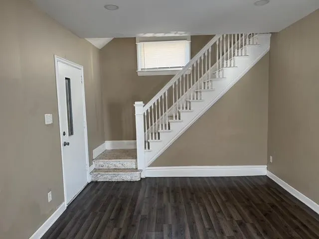 a view of entryway with wooden floor
