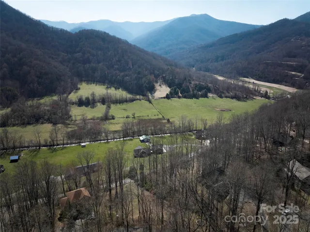 a view of a town with mountains in the background