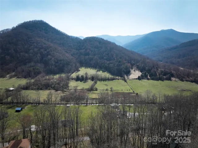 a view of a town with mountains in the background