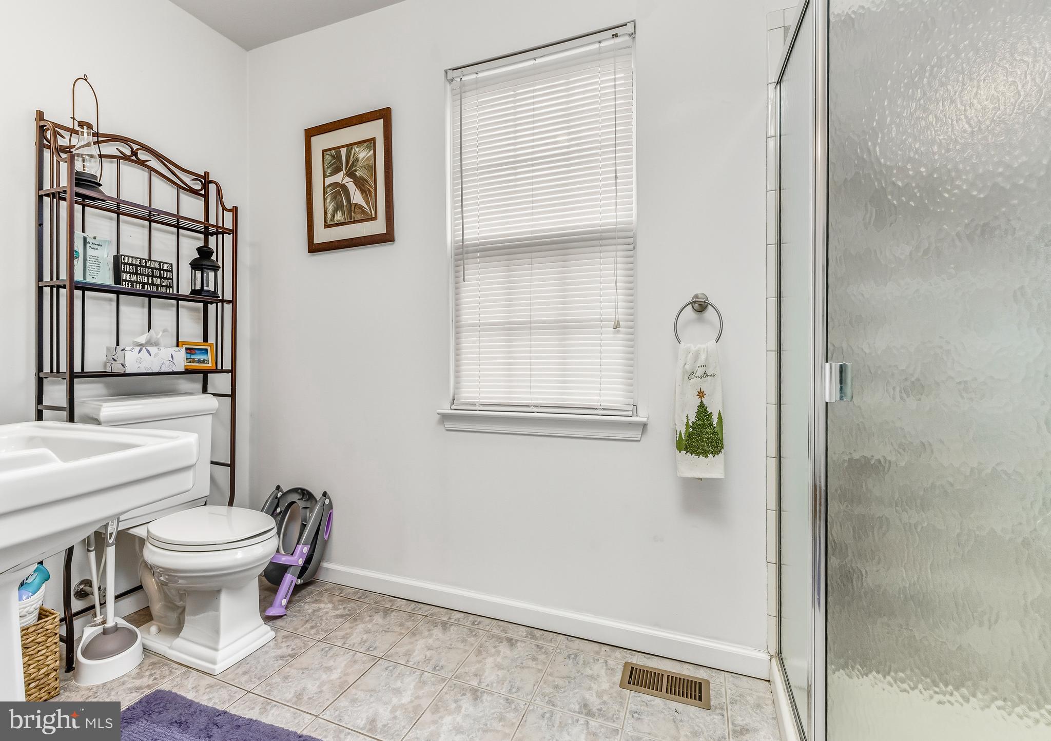 18 Front Street Glendora, NJ 08029 - Photo 14 of 21 a bathroom with a toilet and a shower
