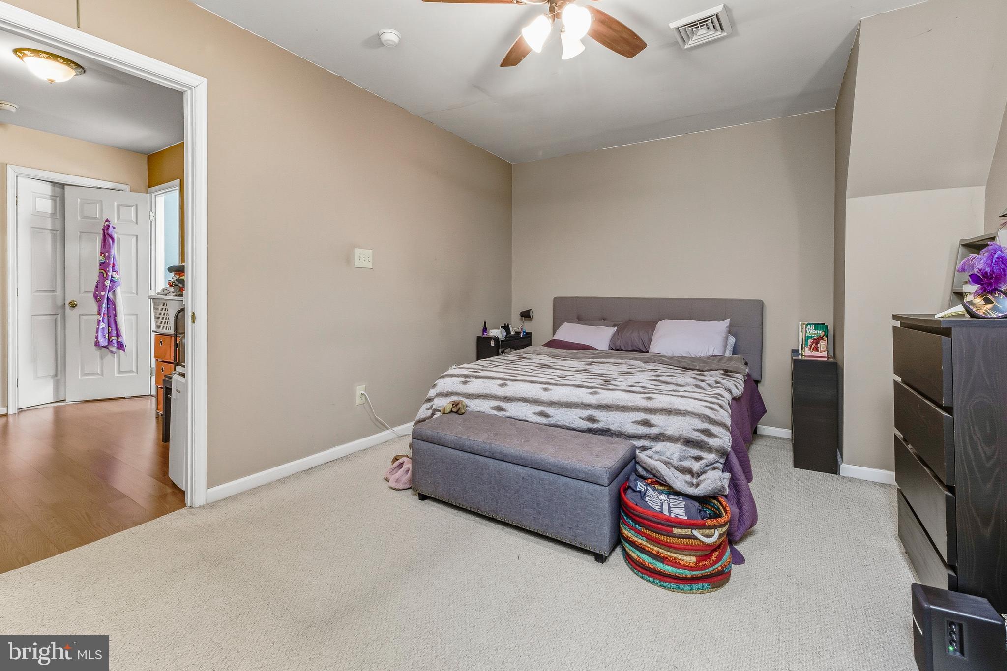 18 Front Street Glendora, NJ 08029 - Photo 16 of 21 a bedroom with a bed and a chandelier