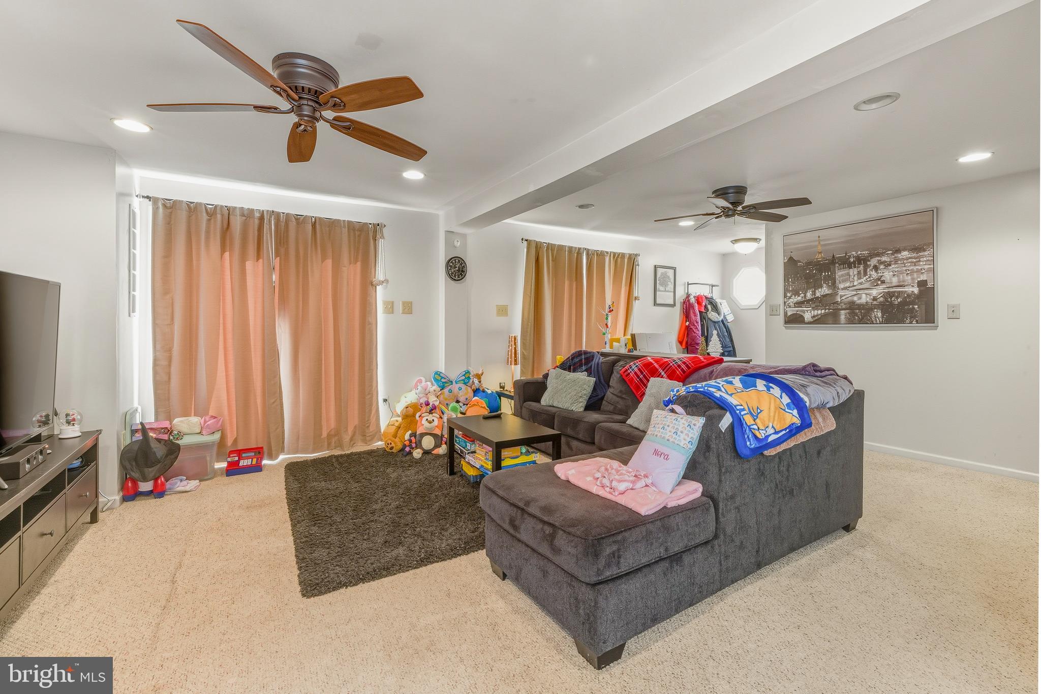 18 Front Street Glendora, NJ 08029 - Photo 8 of 21 a living room with furniture and a flat screen tv