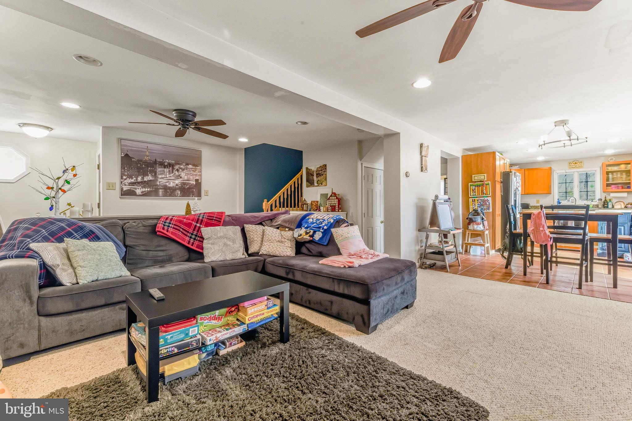 18 Front Street Glendora, NJ 08029 - Photo 9 of 21 a living room with furniture a rug and a chandelier
