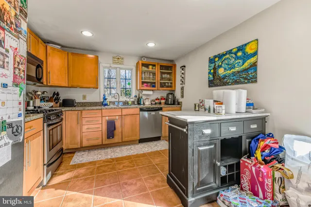 a kitchen with a sink counter top space and appliances