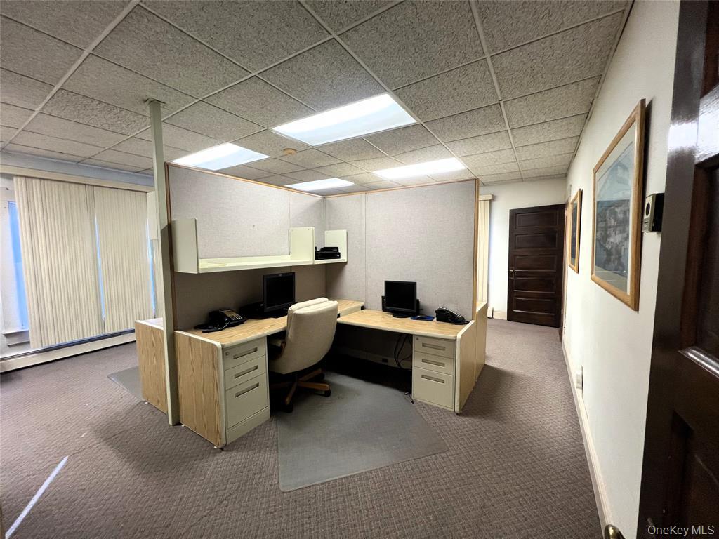 2566 Middle Country Road Centereach, NY 11720 - Photo 15 of 31 a work place with furniture a rug and a window