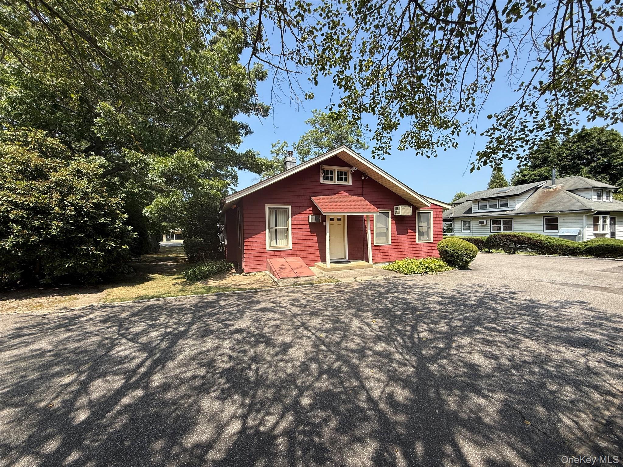 2566 Middle Country Road Centereach, NY 11720 - Photo 29 of 31 a view of a house with a yard