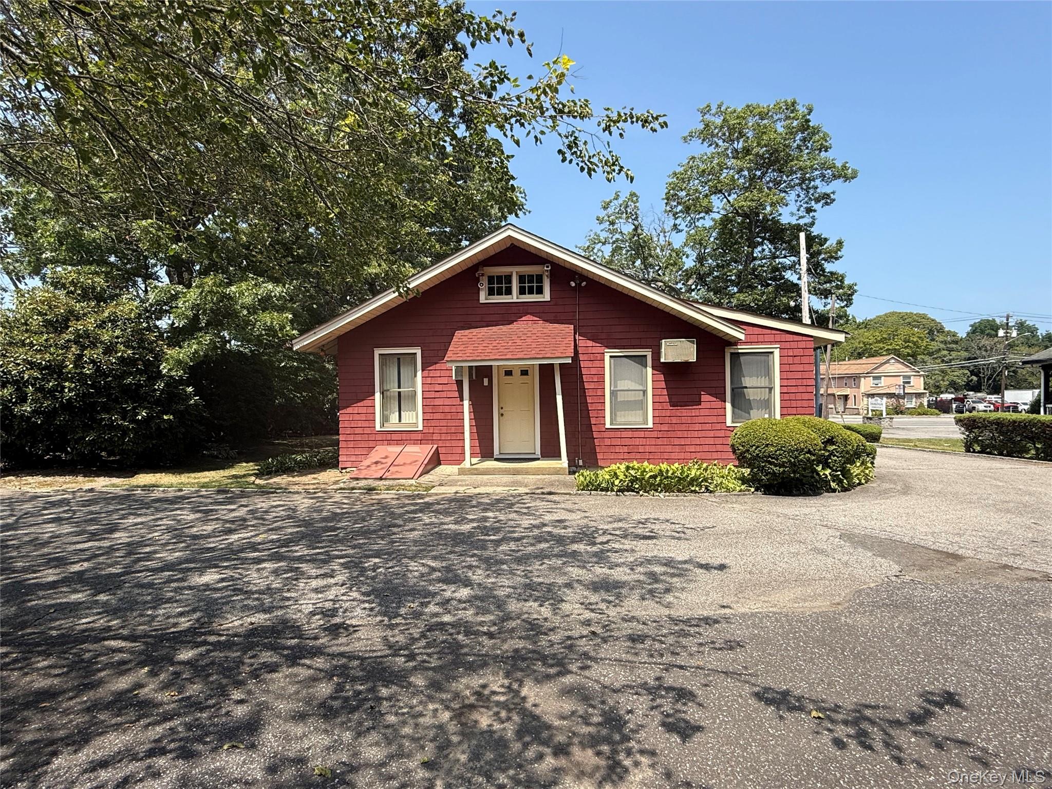 2566 Middle Country Road Centereach, NY 11720 - Photo 30 of 31 a front view of a house with a yard