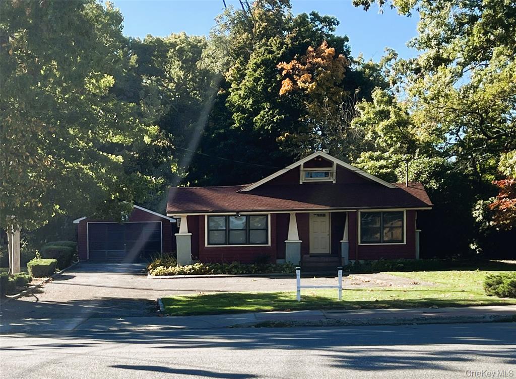 2566 Middle Country Road Centereach, NY 11720 - Photo 4 of 31 a house with a tree in front of it