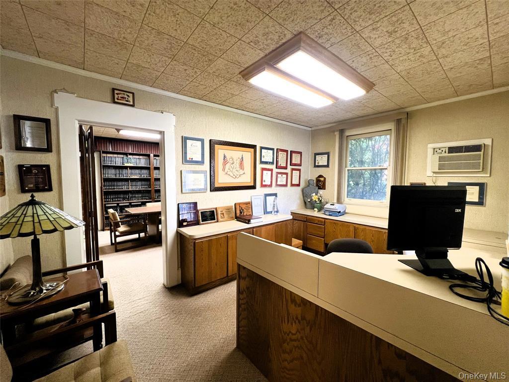 2566 Middle Country Road Centereach, NY 11720 - Photo 5 of 31 a living room with furniture and a flat screen tv