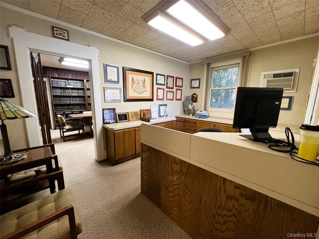 2566 Middle Country Road Centereach, NY 11720 - Photo 6 of 31 a view of a livingroom with workspace and a window