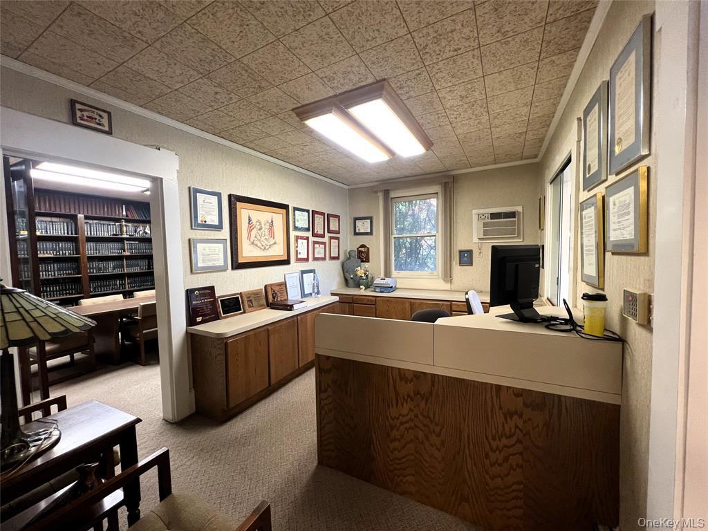 2566 Middle Country Road Centereach, NY 11720 - Photo 7 of 31 a kitchen with sink refrigerator and window