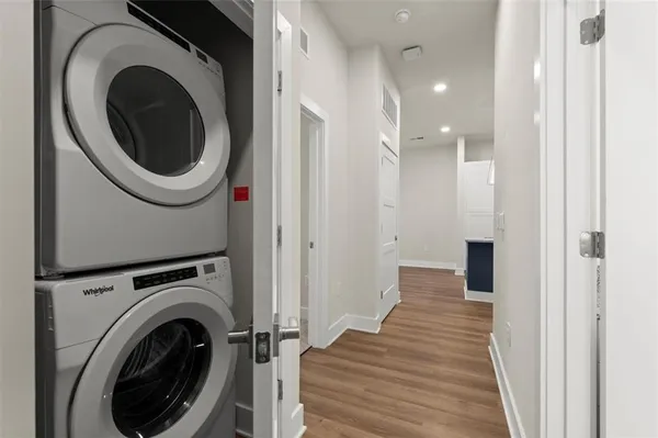 a view of a hallway with washer and dryer