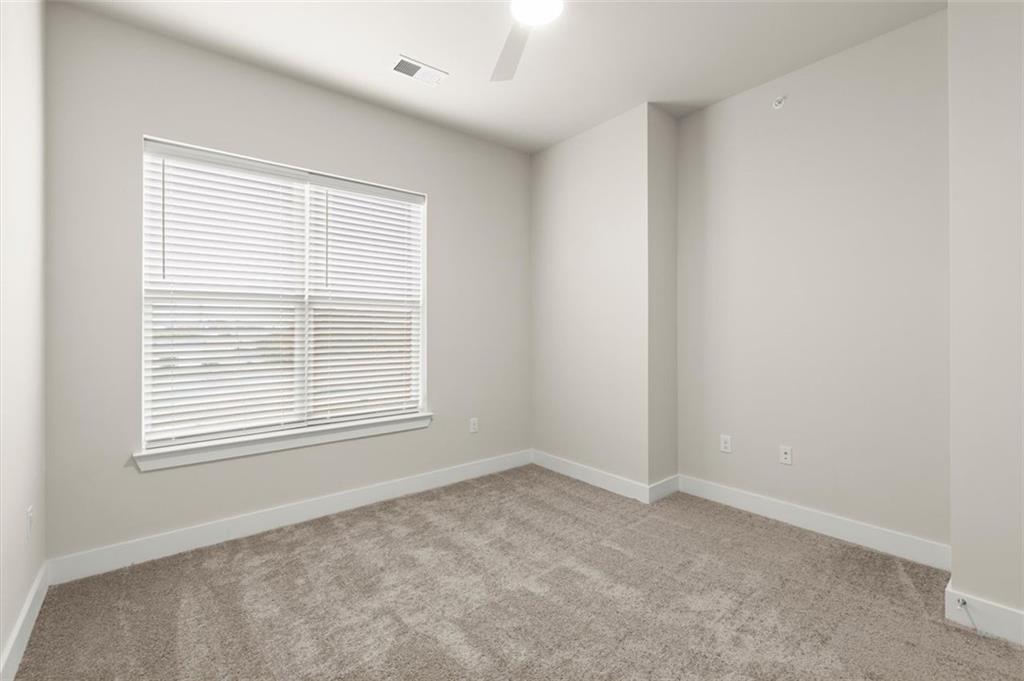 2648 Sandy Plains Road, Unit 424 Marietta, GA 30062 - Photo 18 of 33 a view of an empty room with a window