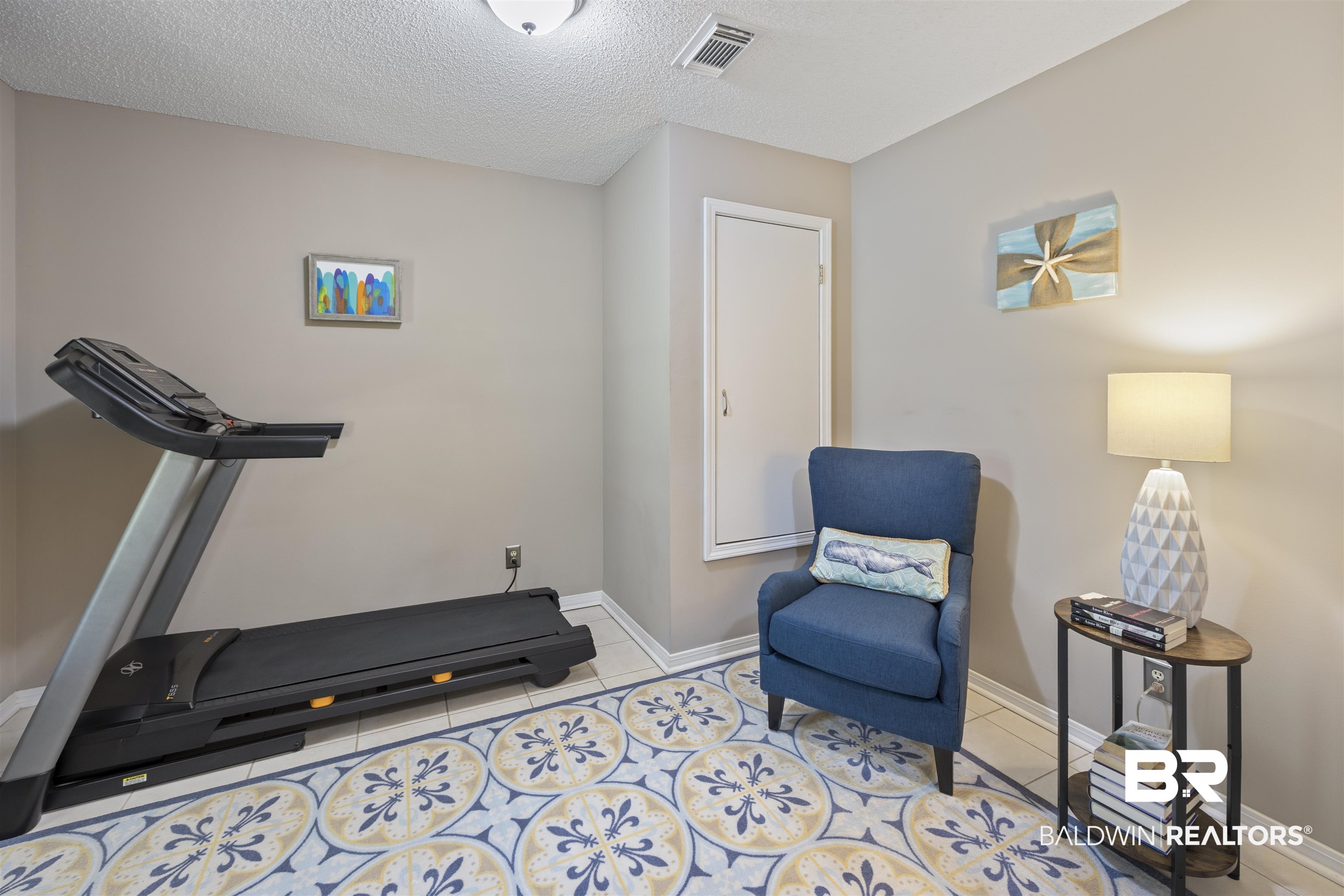 9771 Clarke Ridge Road Foley, AL 36535 - Photo 22 of 72 The room is utilized as a workout room.