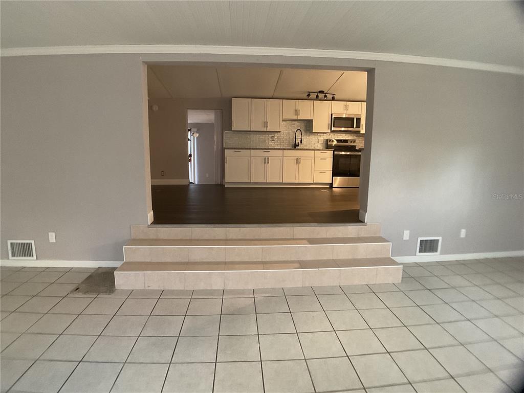 5038 Northeast Sandy Road Arcadia, FL 34266 - Photo 13 of 48 a view of kitchen with furniture and refrigerator