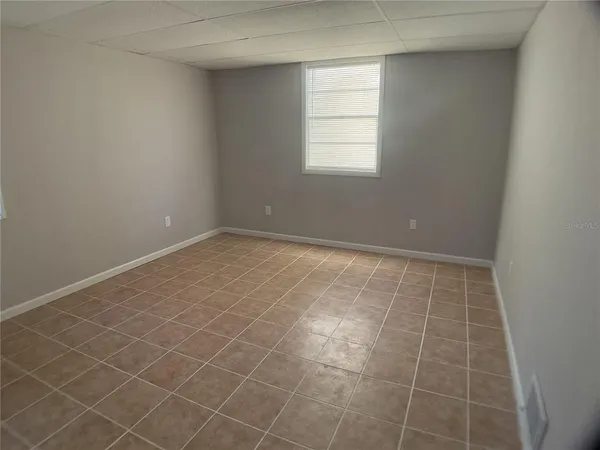 an empty room with a bathroom