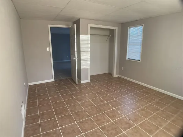 an empty room with a bathroom