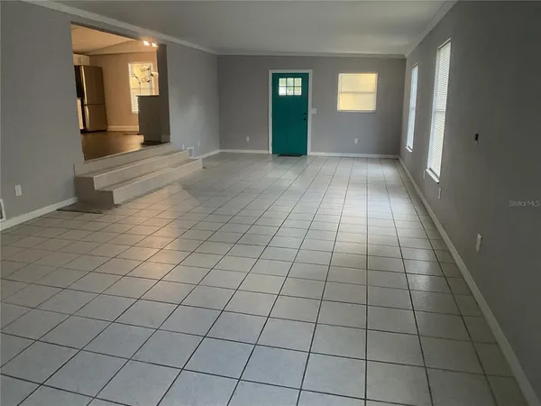 a view of an empty room and window