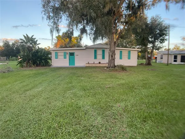 a view of a house with a big yard