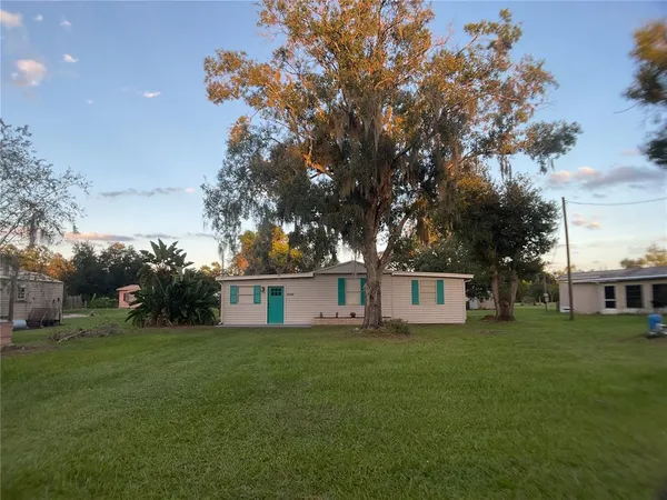 a view of a house with a big yard