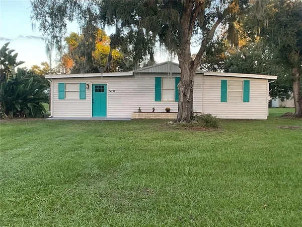 a view of a house with a big yard