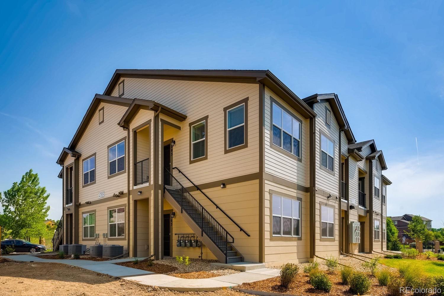 4765 Copeland Circle, Unit 103 Highlands Ranch, CO 80126 - Photo 3 of 28 a front view of a house