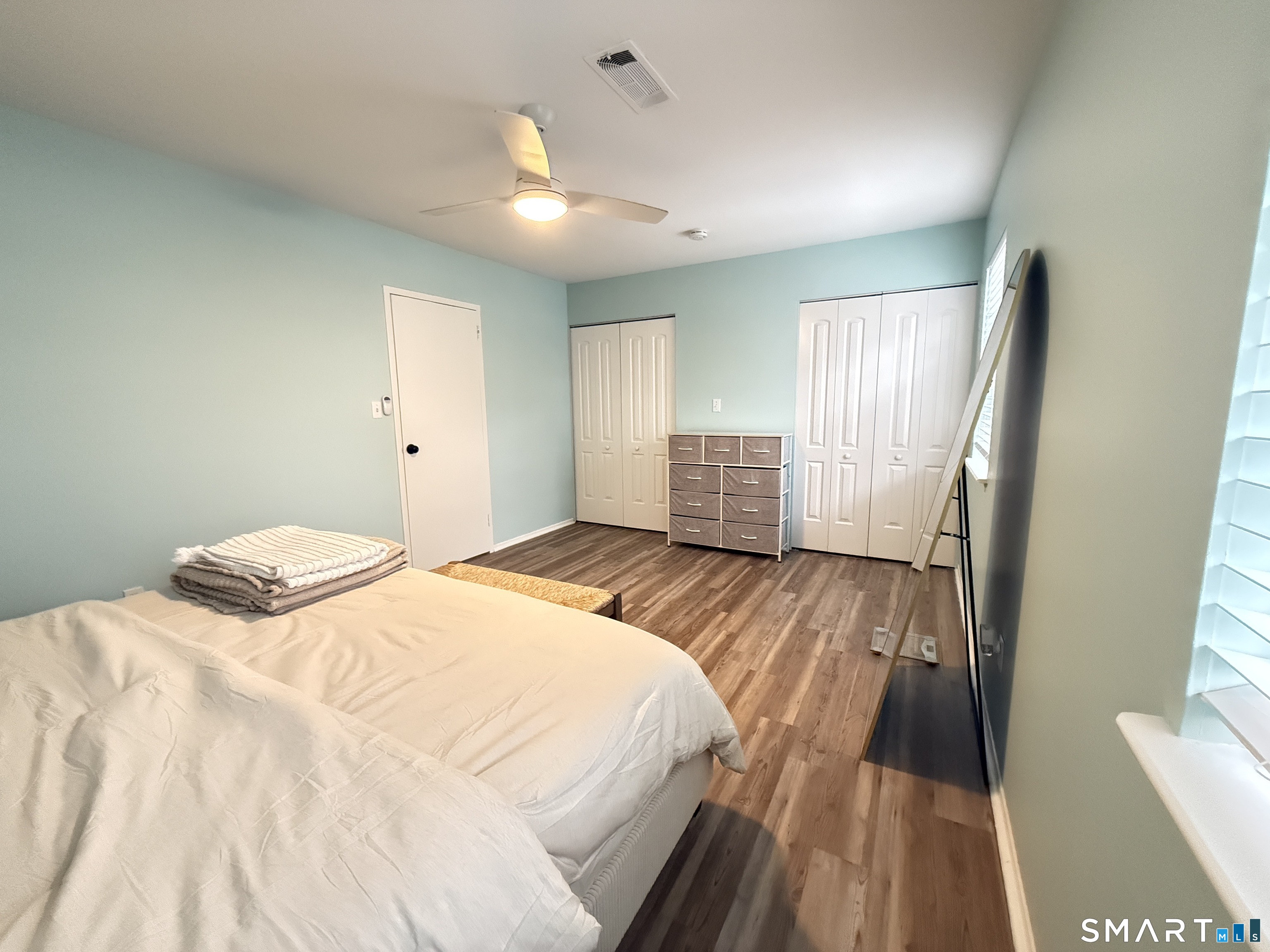 50 Greenhouse Road, Unit 49C Bridgeport, CT 06606 - Photo 11 of 16 a bedroom with a bed and a large window
