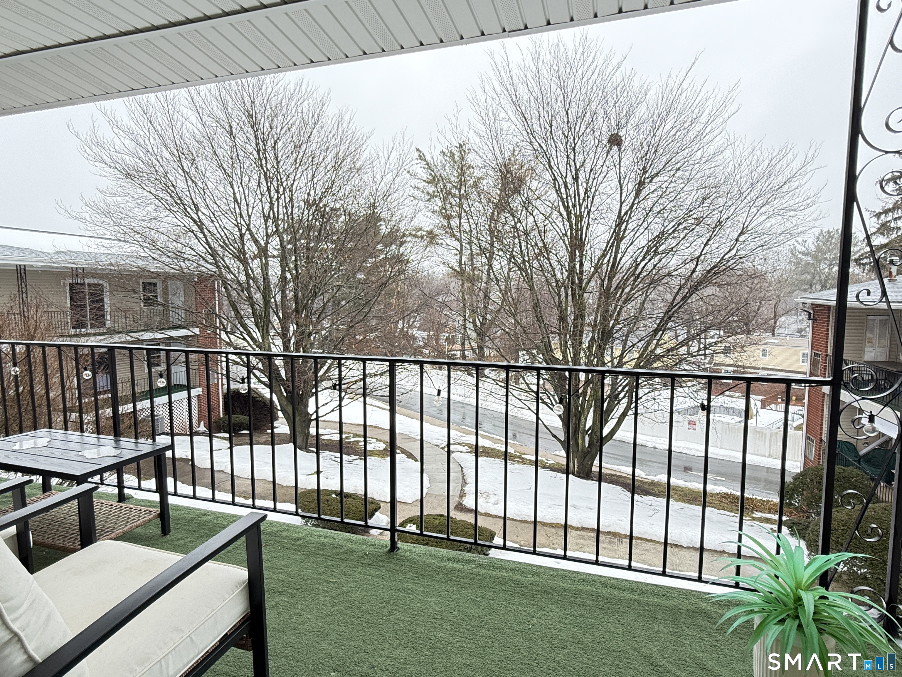 50 Greenhouse Road, Unit 49C Bridgeport, CT 06606 - Photo 13 of 16 a view of backyard with a deck and wooden floor