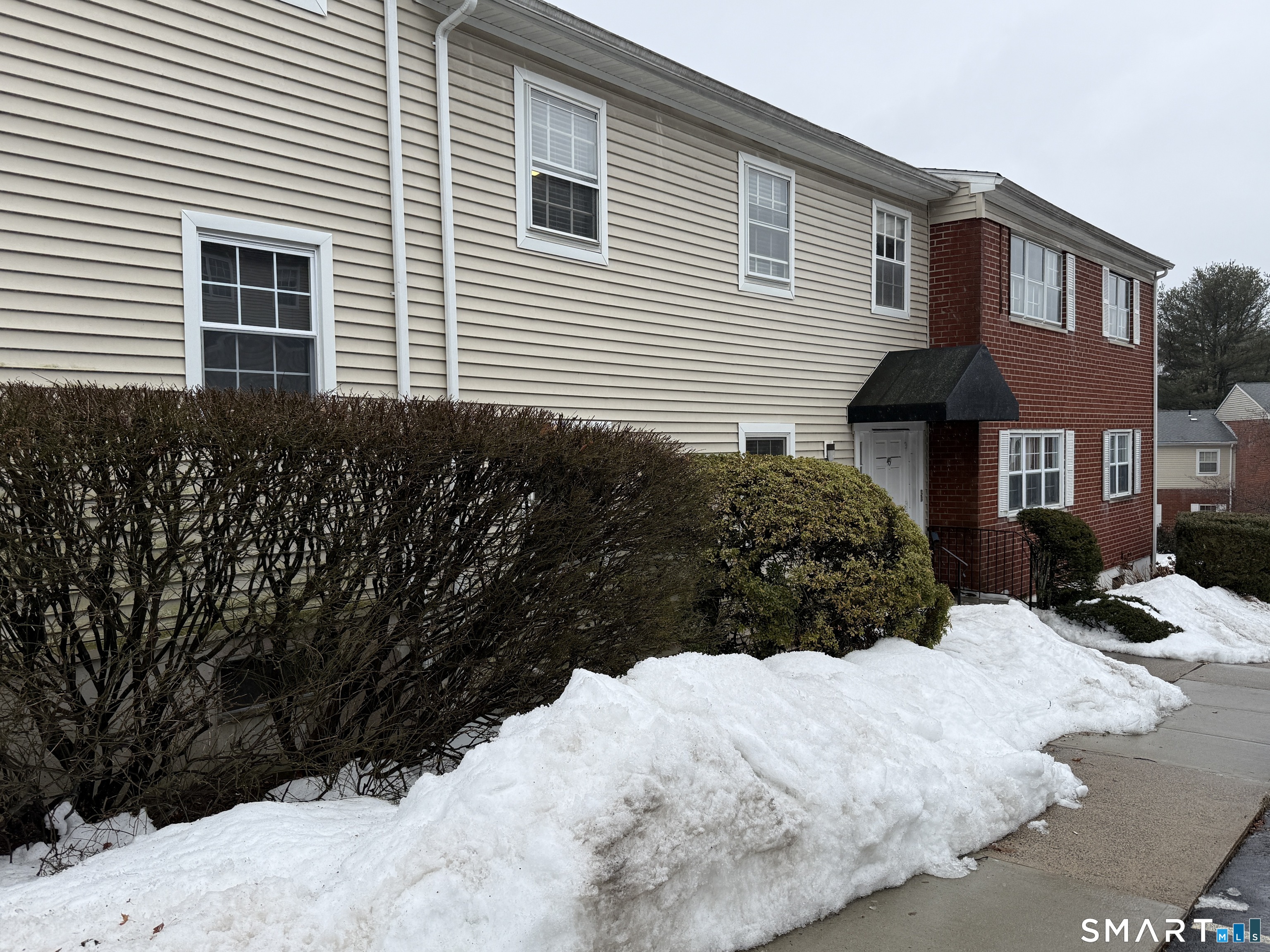 50 Greenhouse Road, Unit 49C Bridgeport, CT 06606 - Photo 16 of 16 a view of a house with a yard