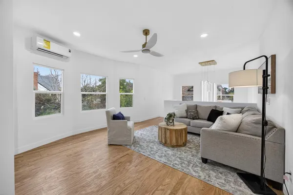 a living room with furniture and a large window