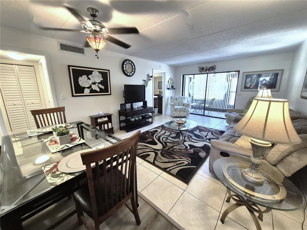 107 Windward Place, Unit 107 Oldsmar, FL 34677 - Photo 5 of 34 a living room with furniture and a flat screen tv