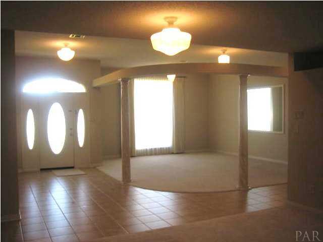 1080 Palisade Road Pensacola, FL 32504 - Photo 4 of 20 View of foyer and dining room from family room