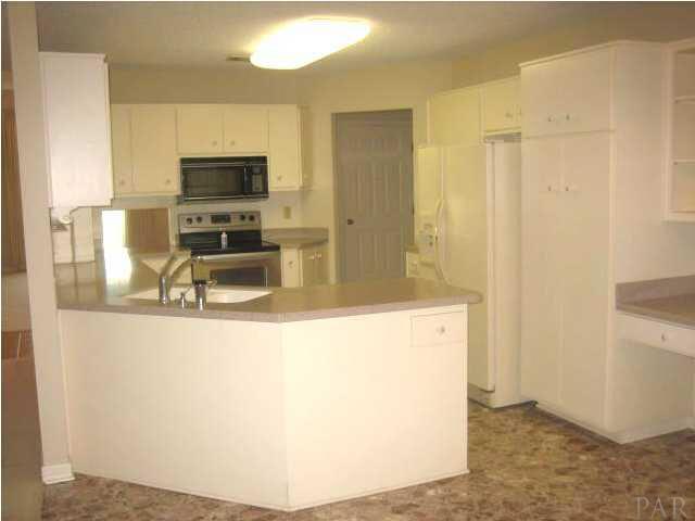 1080 Palisade Road Pensacola, FL 32504 - Photo 6 of 20 Kitchen with breakfast bar and desk