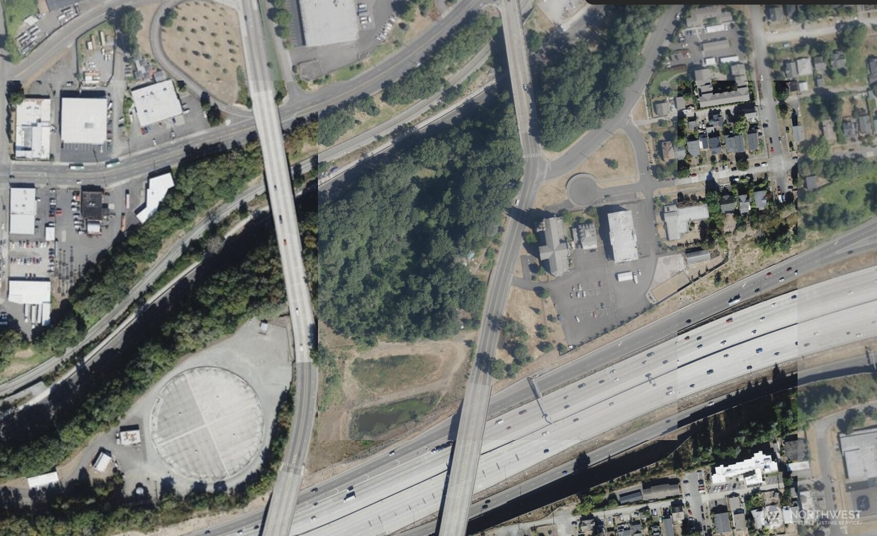 616 South 30th Street Tacoma, WA 98402 - Photo 2 of 4 an aerial view of a residential apartment building with a yard