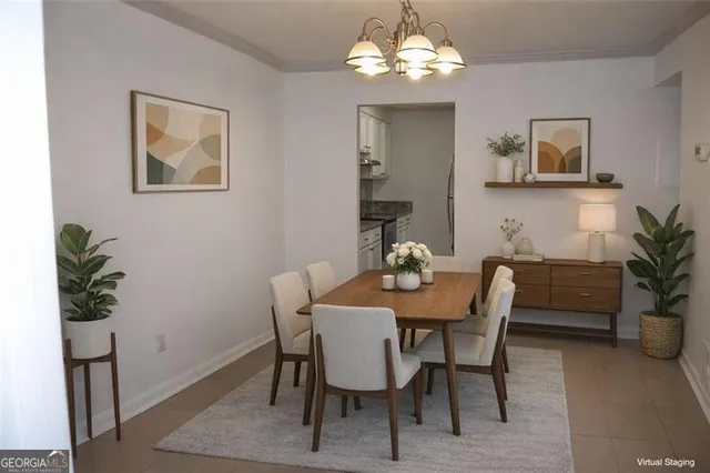 a view of a dining room with furniture and chandelier
