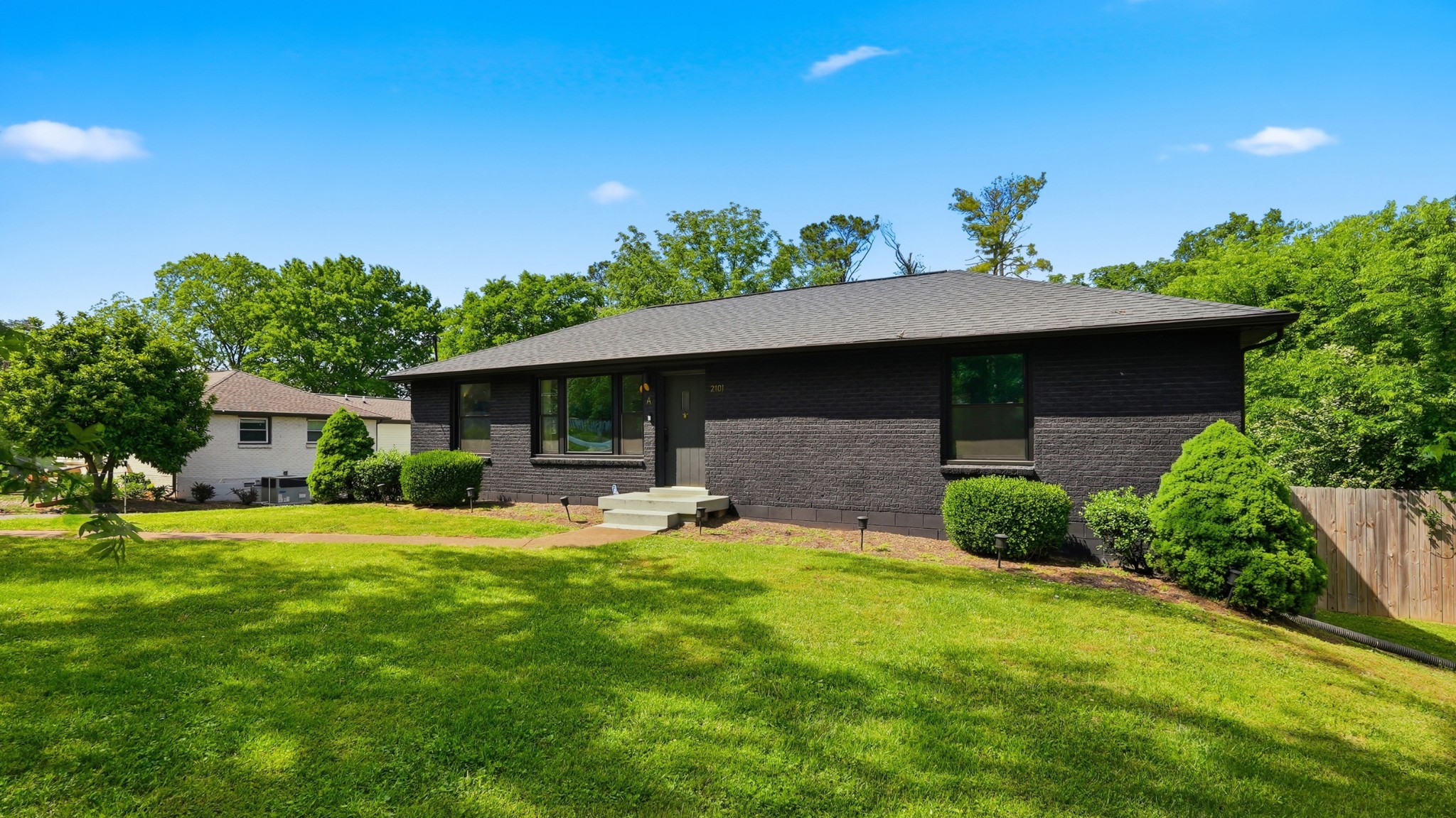 2101 Porter Road Nashville, TN 37216 - Photo 45 of 48 a front view of a house with a garden and yard