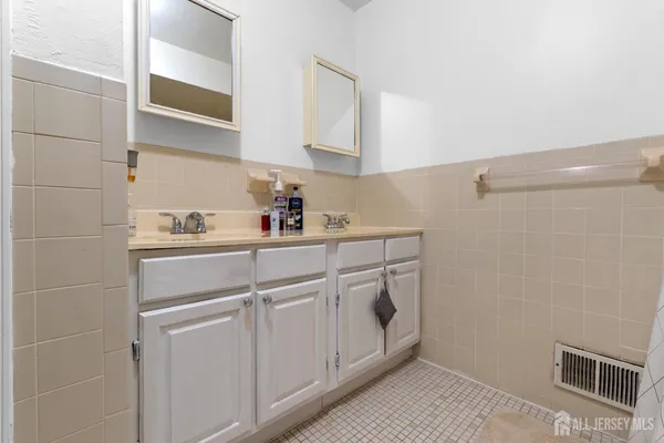 a kitchen with cabinets and window