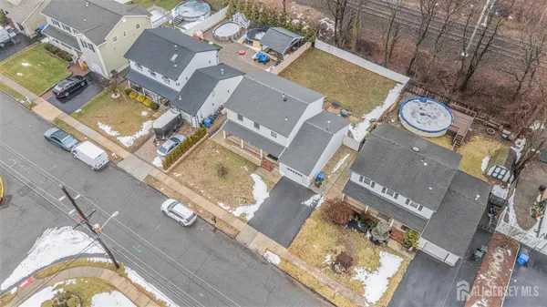 an aerial view of a residential apartment building with a swimming pool