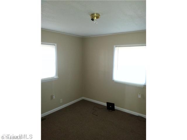 208 Romey Brown Road Siloam, NC 27047 - Photo 5 of 7 1st Bedroom.
