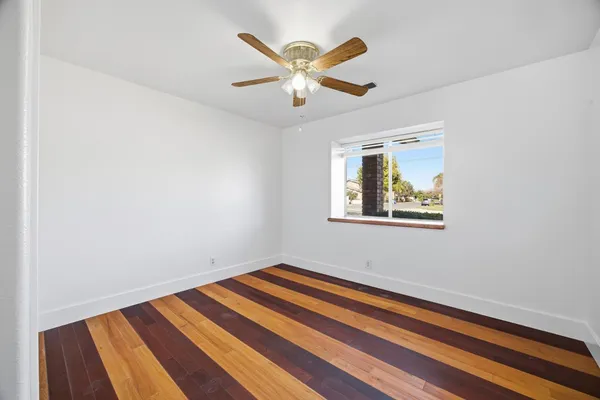 a room with window and ceiling fan