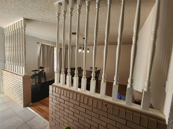 a view of a porch with wooden floor