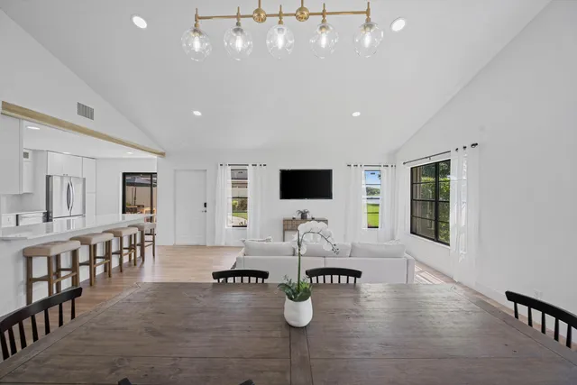 a view of a dining room with furniture window and outside view