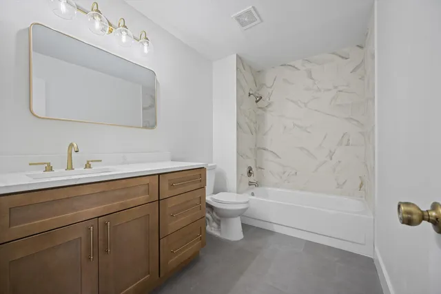 a patio with table and chairs