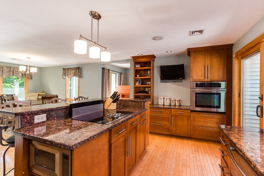 28 Lincoln Point Road Charlton, MA 01507 - Photo 8 of 26 a kitchen with stainless steel appliances granite countertop a sink stove and refrigerator