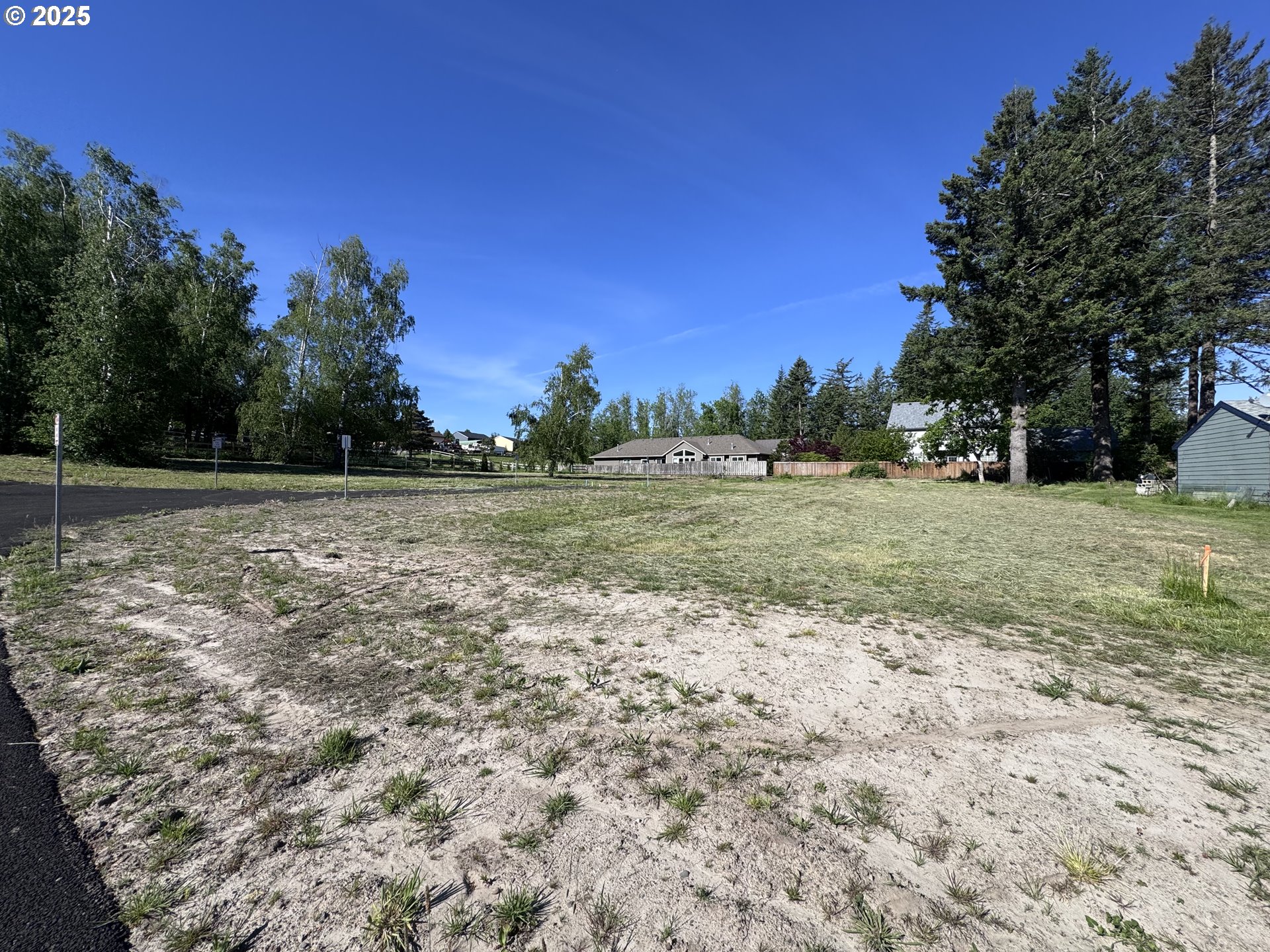 0 Southeast Sweetbriar Road, Unit 5 Troutdale, OR 97060 - Photo 5 of 15 a view of a field with trees in the background