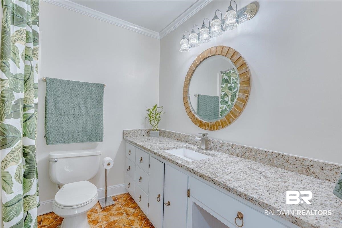 440 Dykes Road Mobile, AL 36608 - Photo 21 of 49 Full bath featuring baseboards, toilet, ornamental molding, and vanity