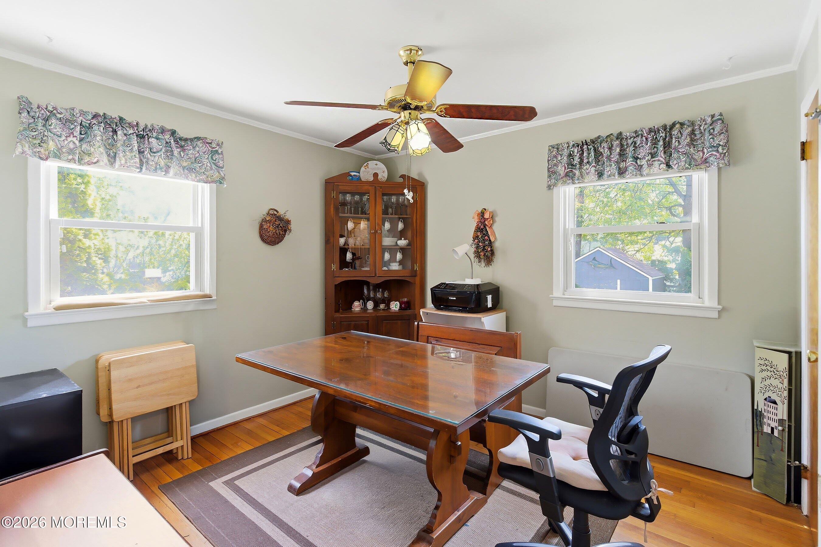 412 Moore Road Neptune Township, NJ 07753 - Photo 13 of 36 a view of a workspace with a window and a dining table