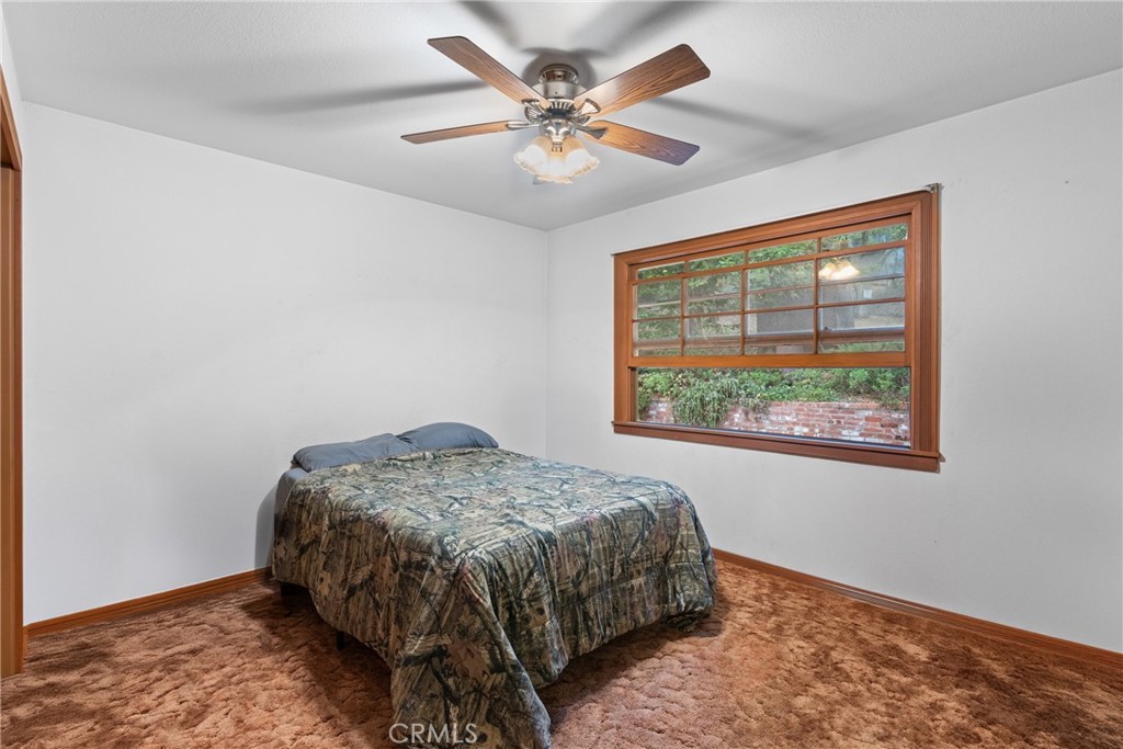 6650 Toro Creek Road Atascadero, CA 93422 - Photo 15 of 28 a bed sitting in a room next to a window