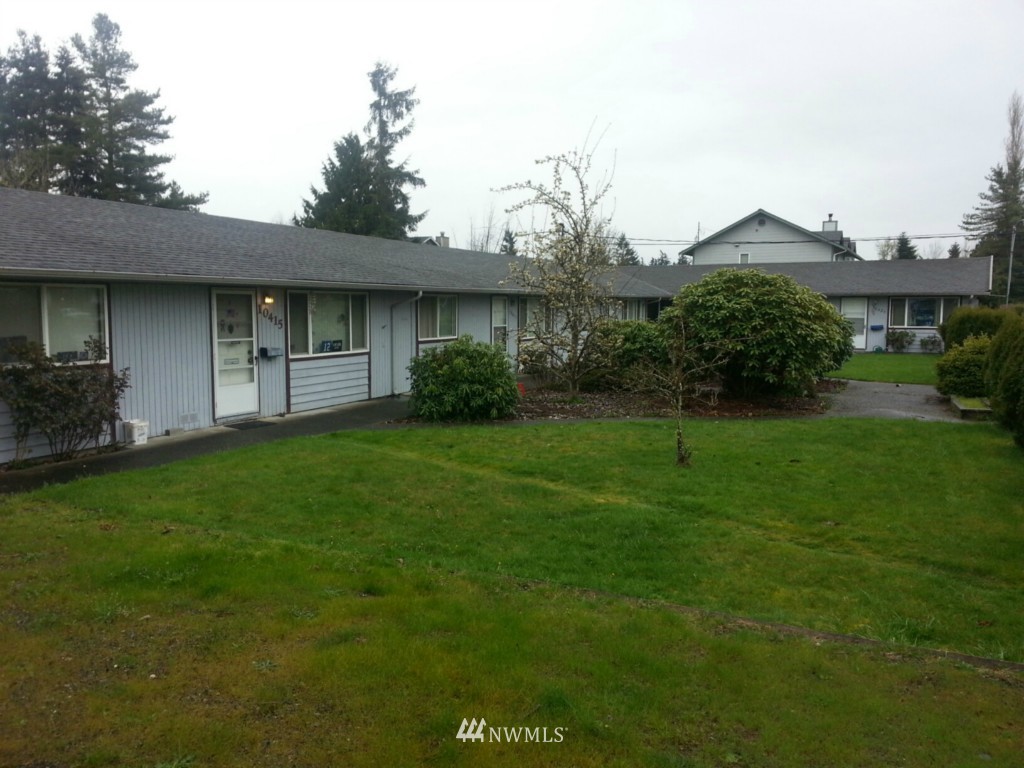 10415 Golden Given Road East Tacoma, WA 98445 - Photo 1 of 14 a house view with a garden space
