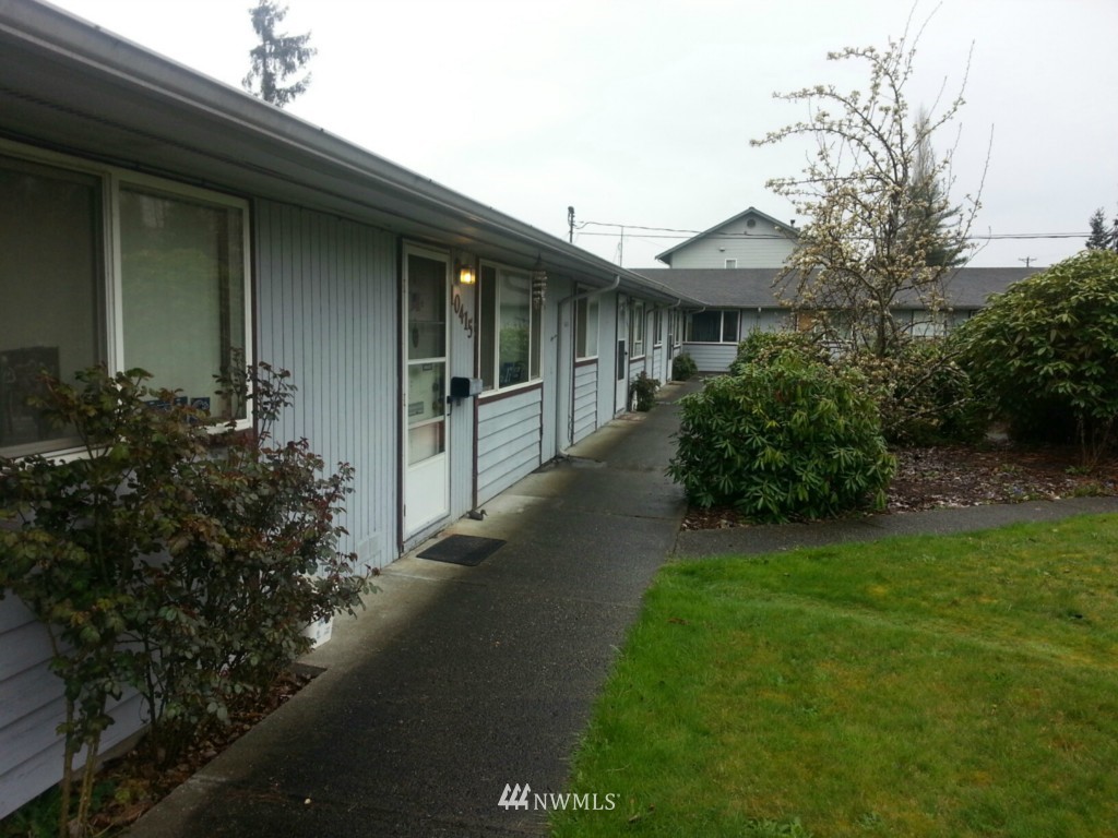 10415 Golden Given Road East Tacoma, WA 98445 - Photo 2 of 14 a backyard of a house with lots of green space
